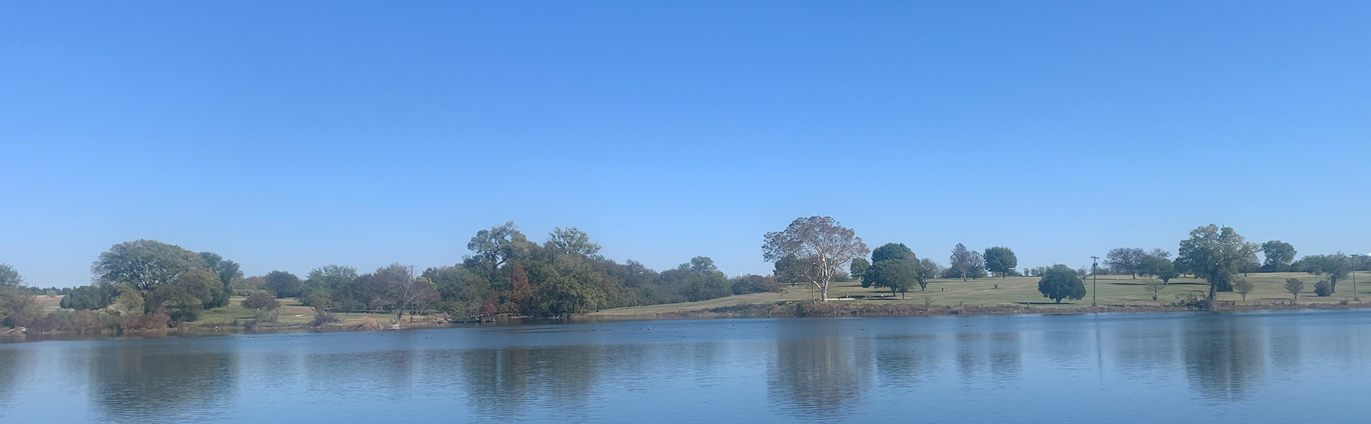 view of pond on golf course